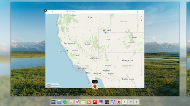 A screenshot of the Multitasking View in elementary OS. This is an overview of workspaces and open apps. The dock replaces the old workspace switcher at the bottom of the screen.