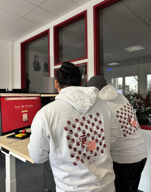 Tuta employees wearing a Tuta hoodie
