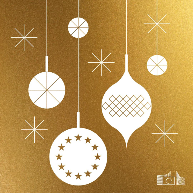 Gold background with white hanging Christmas ornaments, including one featuring the circle of EU stars. Several star-shaped decorations are scattered around, and the European Commission logo appears in the bottom right corner. 