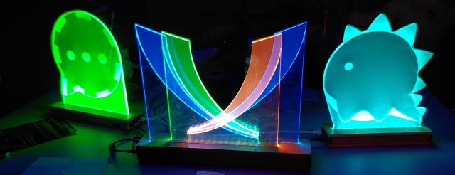 The XMPP assembly table at the 39c3 with iconic XMPP and XMPP clients light art.