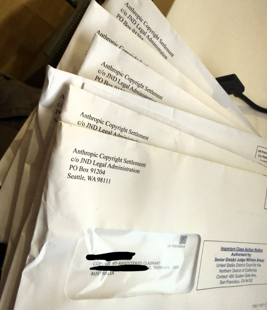 A stack of envelopes from the Anthropic settlement