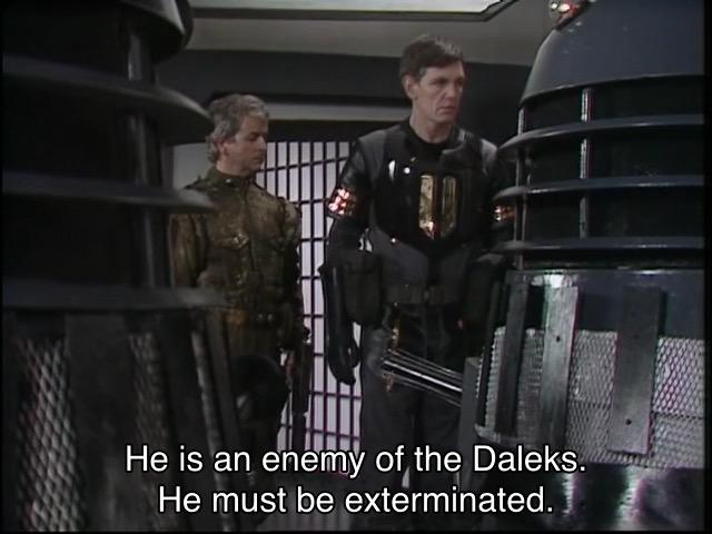 Peter Davison episode. The Doctor is on a spaceship in the future, and you can tell, because the walls are all gray with big light panels on them. He’s surrounded by a bunch of Daleks (gray ones) and a few humans in future space outfits. A Dalek says, “He is an enemy of the Daleks. He must be exterminated.” Closeup on one of the people as he says, “He must be duplicated first.” Huh, they usually leave that part out.