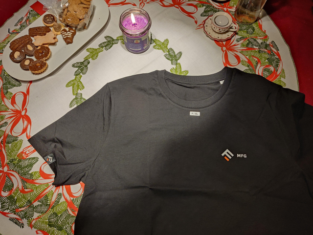 Unpacked black t-shirt with a decent company logo. 