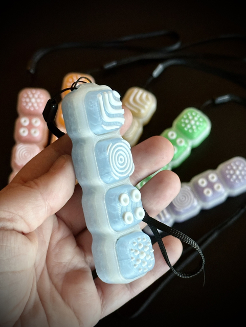 Example of the ‘ice’ style for these keyboard clickers. The base transitions from light translucent blue to ice white with blue keycaps with various textures. 