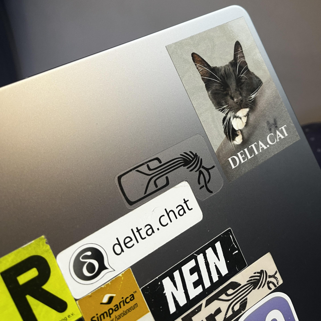 part of laptop backside with Delta Chat and CCC typical stickers