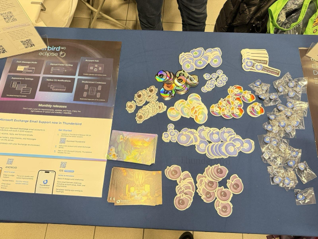 A table full of Thunderbird stickers