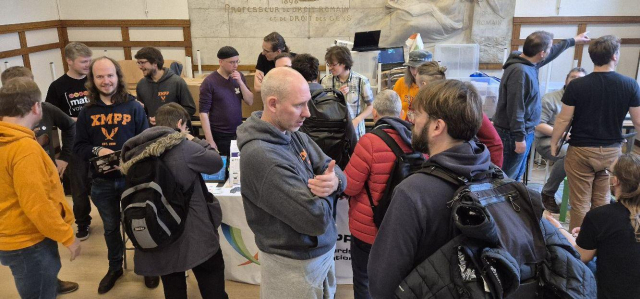 The XMPP Booth hidden infront of a crowd.