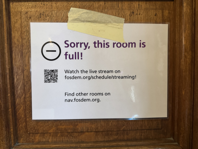 A sign saying the room is full