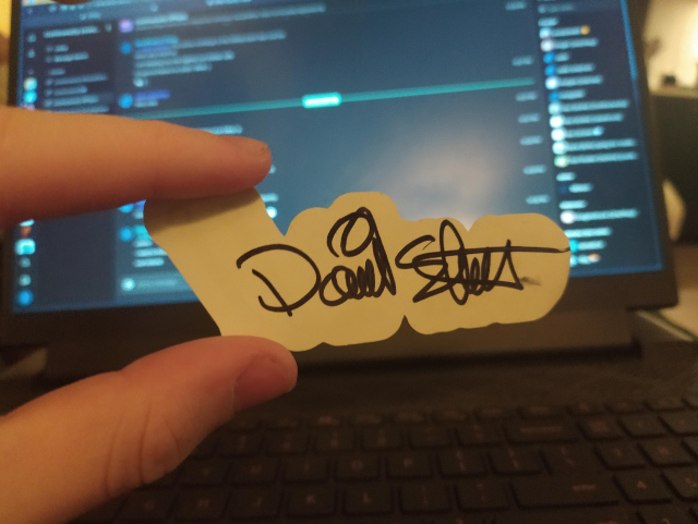 The back side of a curl sticker, with Daniel's signature!