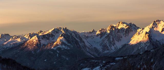 Alps at sunset with gradients of color temperature from warm to cold.