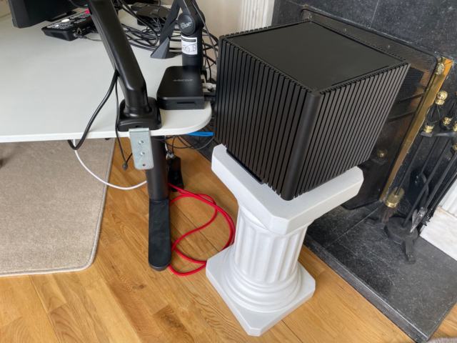 My desktop computer: a black cube, on a small Greek column pedestal.