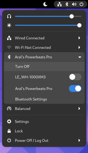 Screenshot of status menu showing Bluetooth section with previously-paired headphones and switches to connect/disconnect to them.
