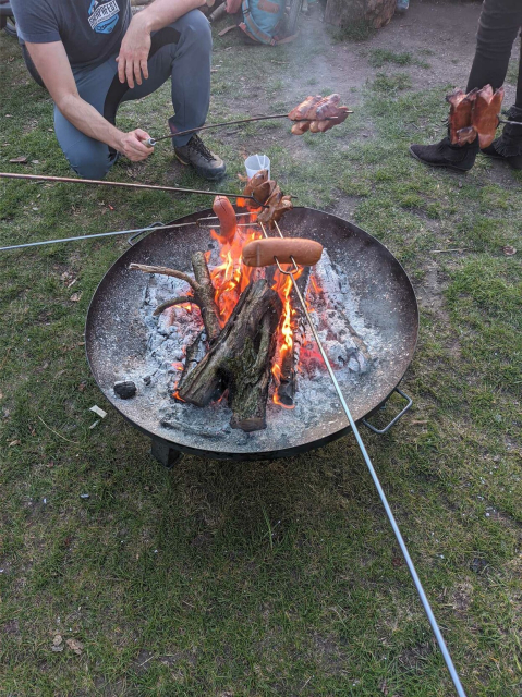 Sausage on the stick above a fire